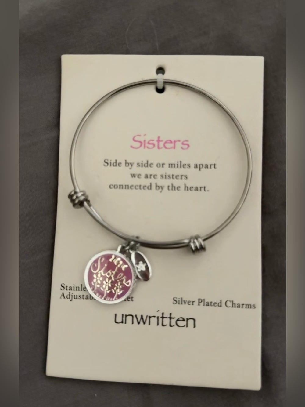 Unwritten Silver-Plated Adjustable Bangle Bracelet with Pink Sister Charm